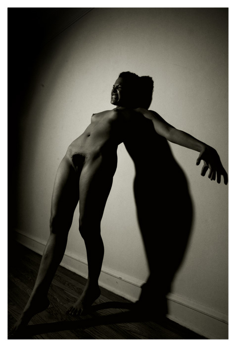 nude woman in shadow