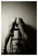 erotic art photo of woman bending over chari